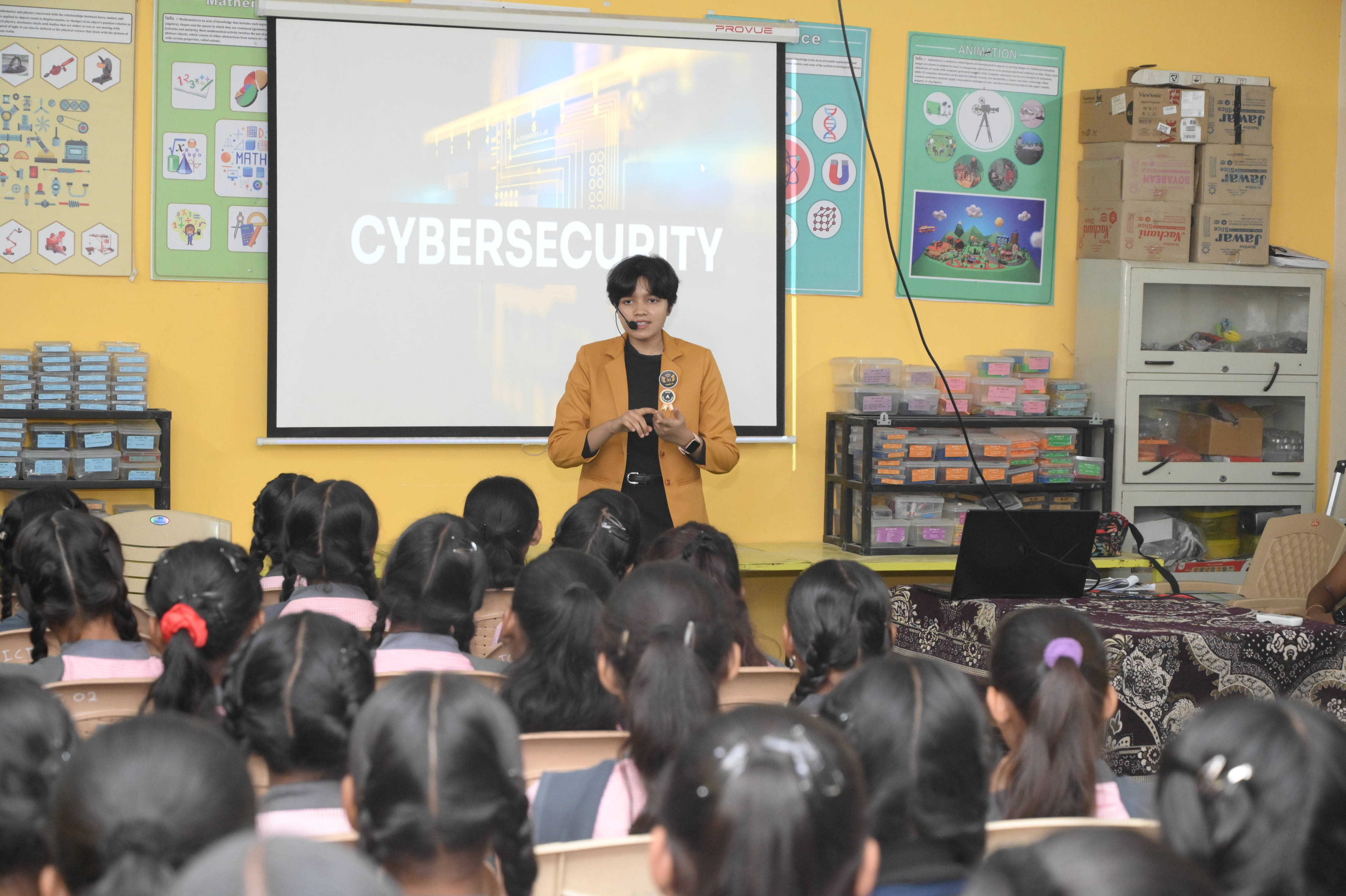 Angel Malewar conducting a school seminar for students