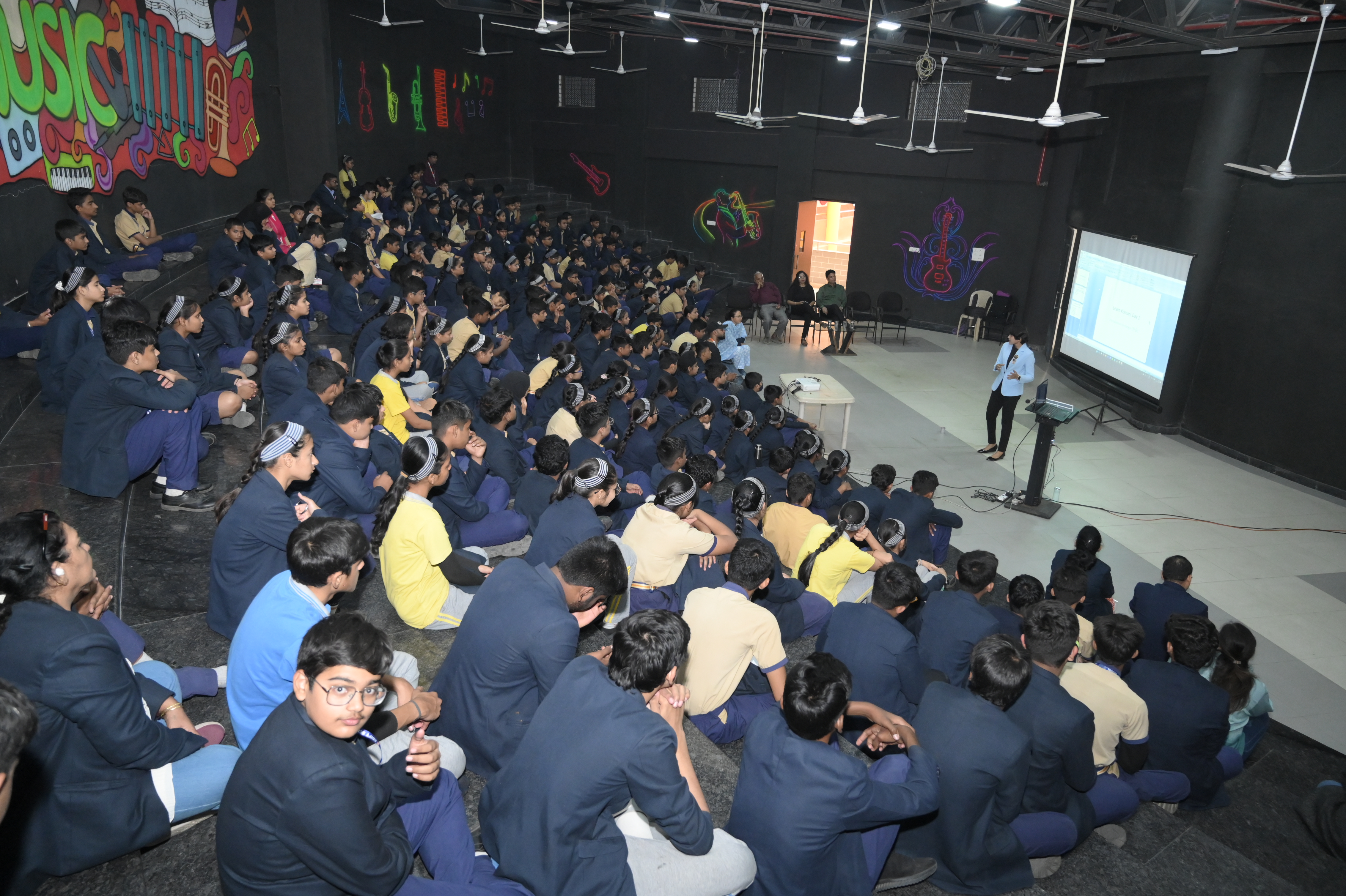 Angel Malewar presenting a cybersecurity session to students